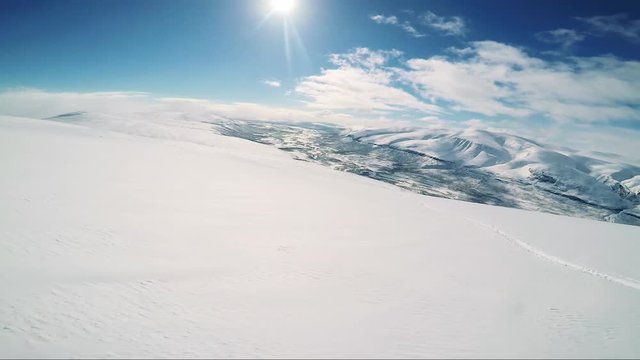 Man skier skiing down mountain alone - sunny day - first person view
