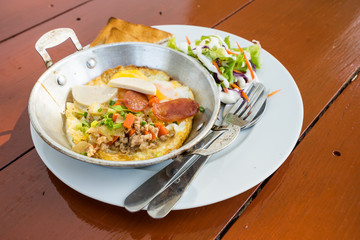 sunny egg in thai style in pan on morning