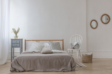 Fototapeta na wymiar Interior of white and gray cozy bedroom