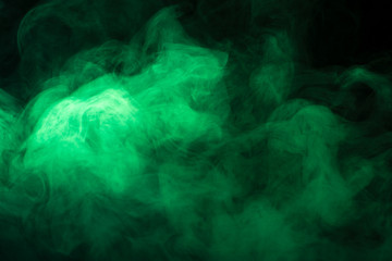 Green smoke texture on a black background