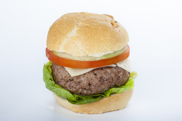 Giant homemade burger classic american cheeseburger isolated on white
