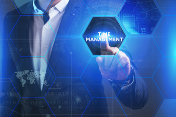 Business, Technology, Internet and network concept. Young businessman working on a virtual screen of the future and sees the inscription: Time management