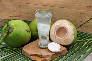 Fresh Coconut Water Drink on wooden  background 