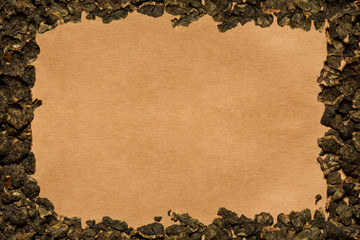 Background of cartboard with a frame made of tea