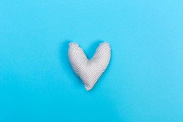 Obraz premium Handmade heart cushions on a blue background