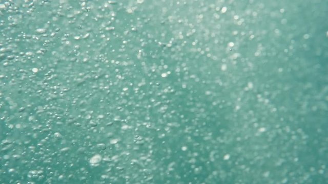 Bubbles rising to the surface. Air bubbles in water in sea (underwater shot), good for backgrounds. Slow motion.
