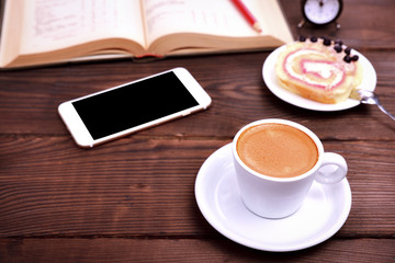Fototapeta na wymiar Cup of coffee, smartphone
