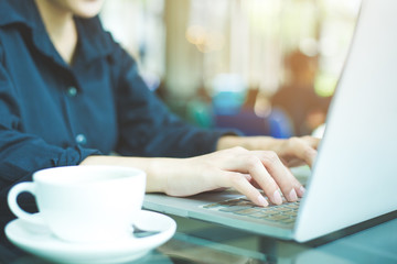 Business woman hand working laptop computer in office