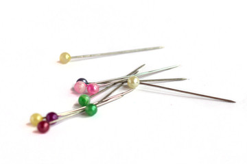Sewing needles on white background