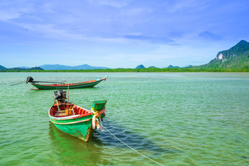 Long Tail Boats on a nice weather day at the sea, southern Thailand