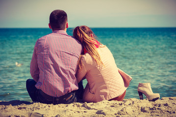 Happy couple having date on beach