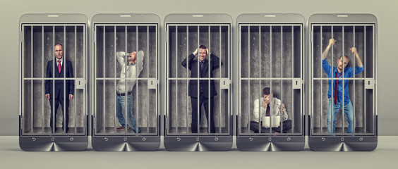 people imprisoned cell smartphone. social media addiction, internet