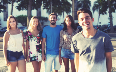 Obraz premium Handsome caucasian man with latin hipster group