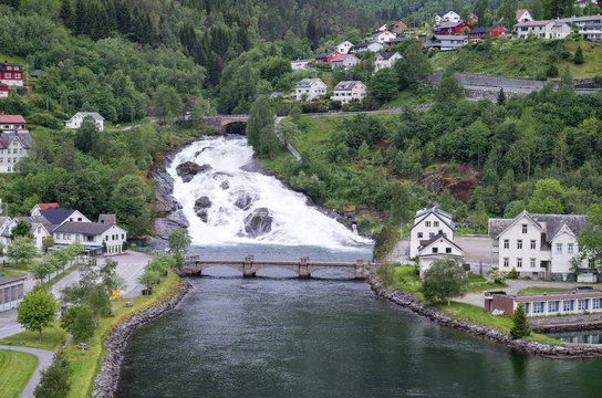 Hellesyltfossen, a waterfall that divides the village of Hellesylt (Norway) into two parts and is ranked as popular tourist attraction.