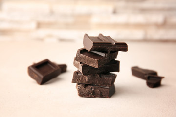 Broken chocolate pieces on table