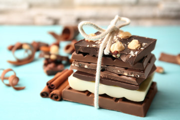 Tied chocolate pieces with cinnamon on table