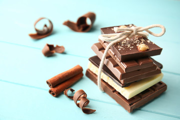 Tied chocolate pieces with cinnamon on table