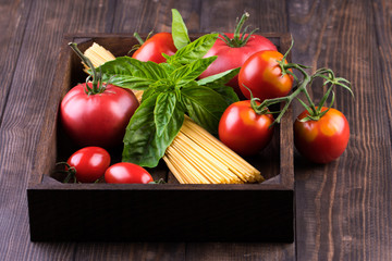Close-up of fresh, ripe tomatoes on wood background