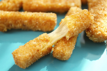 Plate with cheese sticks, closeup