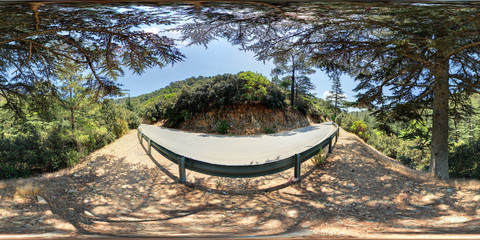 360 degree spherical panorama from Cyprus (Paphos region), Cedar valley. Road, fence, stones, trees and mountains.