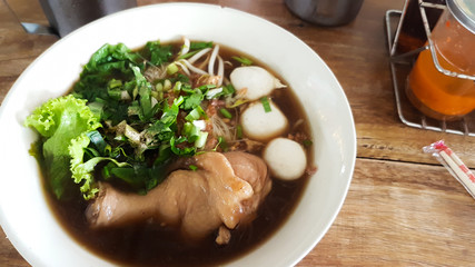 Chicken leg noodle with chicken ball in bowl