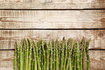 Green asparagus on grey wooden table