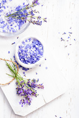 Obraz na płótnie Canvas ingredients for lavender spa, flower and salt on white wooden background.