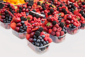 Fresh fruit  in transparent plastic  box for sale

