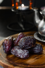 Dates for iftar on wooden board for ramadan month.
