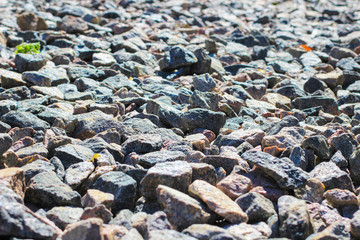 gray and red granite rubble. Construction background.
