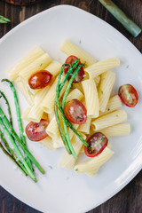 Pasta with asparagus and tomatoes ready to eat