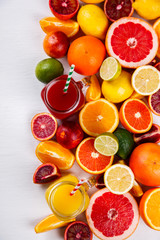 Juices Fresh Orange and Citrus on a White Background.Healthy Beverage.Food or Healthy diet concept.Mixed Colorful Tropical Background.Copy space for Text. selective focus