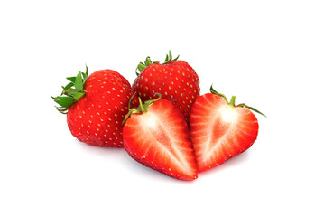 three of fresh strawberry fruits, one sliced in half, isolated on white background