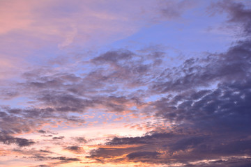 Naklejka na ściany i meble Colorful clouds on blue sky background with sunrise.