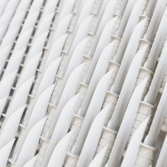 Tight Wall of White Plastic Toy Hunting Knives Presented With Shallow Depth of Field