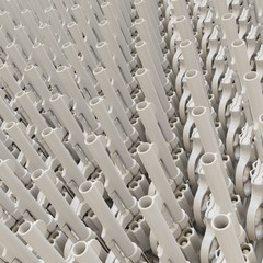 Tight Wall of White Plastic Revolvers Presented With Shallow Depth of Field
