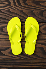 Flip flops on wooden background. Close up