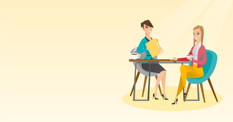 Two businesswomen during business meeting.