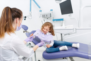 Little girl in dentist chair