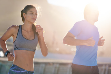 Fit athletic woman running exercising