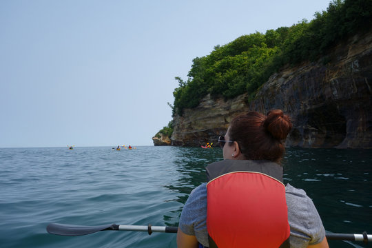 Woman kayaking at Pictured Rocks Michigan
