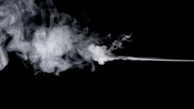 Smoke steam on black background in slow motion.
