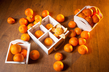 Scattered fruit on a wooden table. Tangerines.