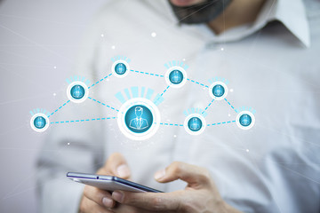 Businessman using hand phone with social network interface