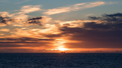 Fototapeta premium fishing vessel sun set east Greenland