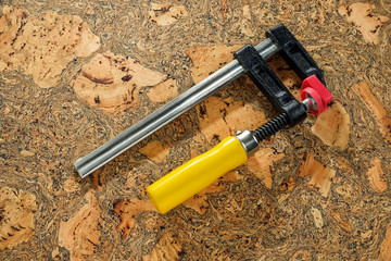 C Clamp, C Clamp lock on wooden background, Mechanic concept