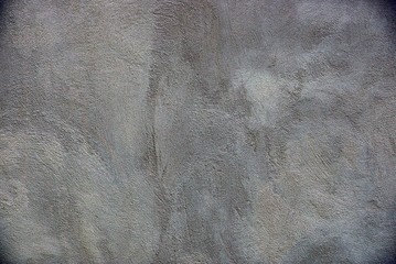 серый фон из части бетонной стены частного здания 