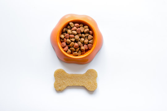 Dry Dog Food In Bowl On White Background Top View