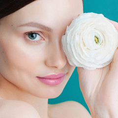 Closeup portrait of attractive caucasian woman brunette isolated on blue background