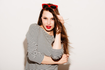 High fashion look.glamor stylish beautiful young happy smiling woman model with red lips and red sunglasses